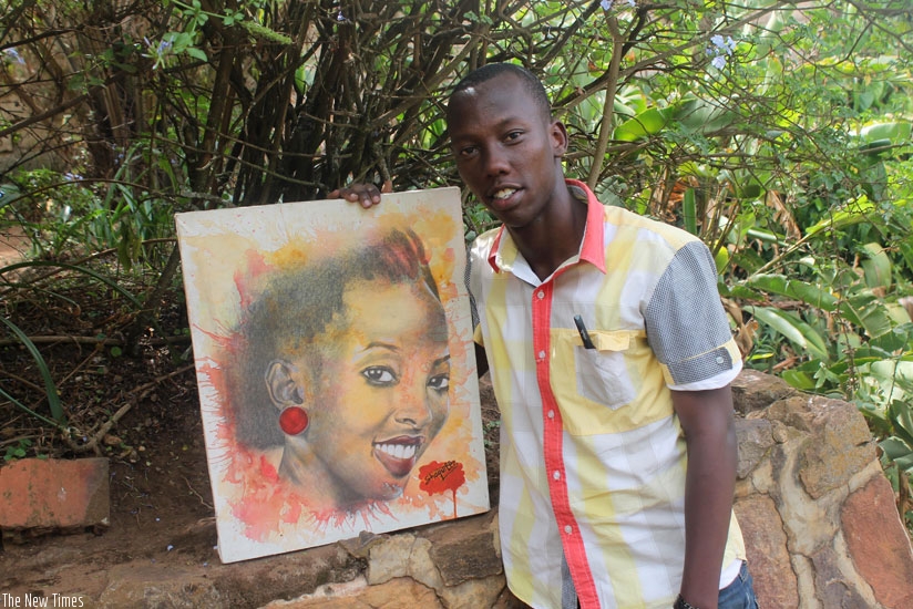 Shaquille Mugisha poses with one of his paintings. (Moses Opobo)