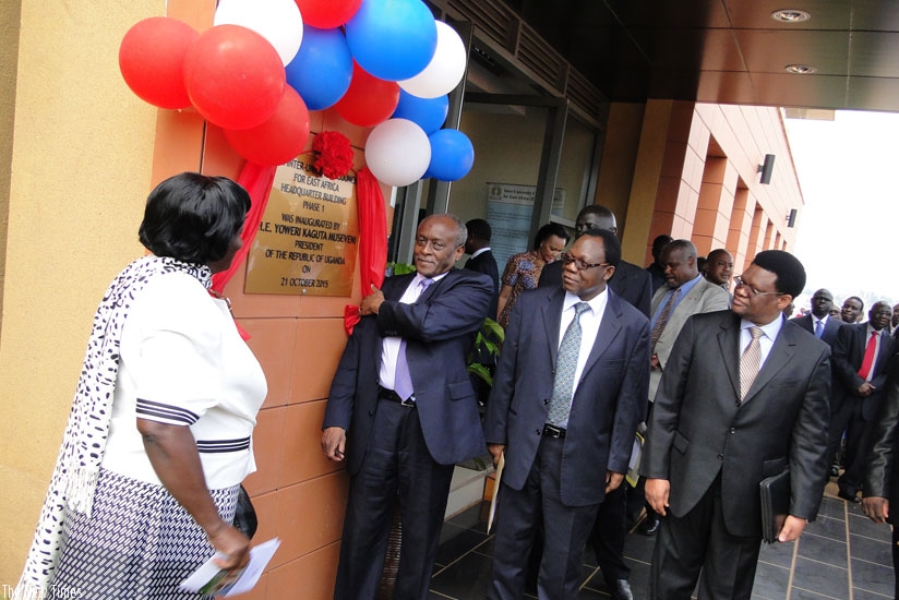 Uganda's EAC Affairs Minister Shem Bageine (holding ribbon) represented President Yoweri Museveni at the inauguration ceremony. Centre is Prof. Nkunya Mayunga, the IUCEA Executive Secretary. Looking on (Left) is Edith Mwanje, the Permanent Secretary in Uganda's Ministry of EAC Affairs. (Gashegu Muramira)rn