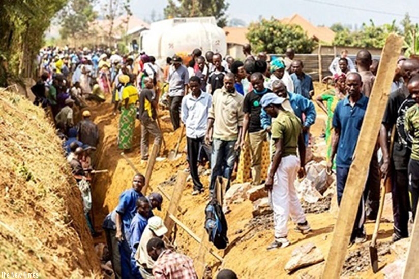 Some Rwandan citizens construct a drainage system during a past Umuganda activity. (File)