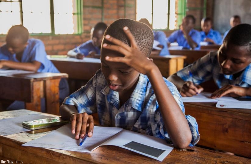 Candidates during the examinations at Catholique Primary School  in Kigali, yesterday. (Faustin Niyigena)