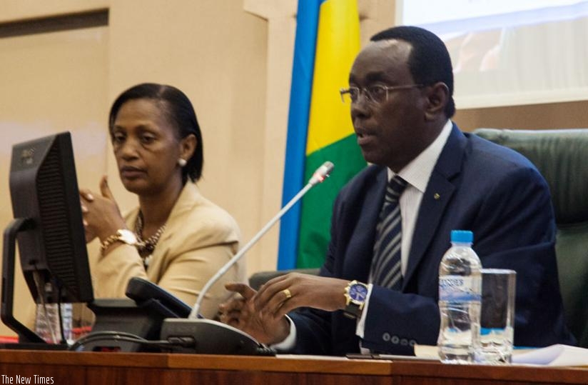 President of the Senate Bernard Makuza (R) and his vice, Jeanne d'Arc Gakuba, during yesterday's plenary. (Faustin Niyigena)