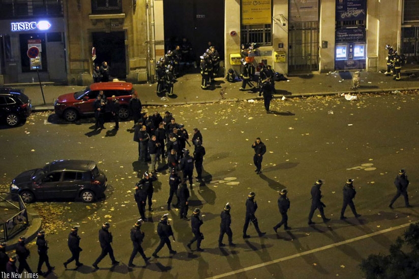 French police with protective shields walk in line near the Bataclan concert hall following fatal shootings. (Net)