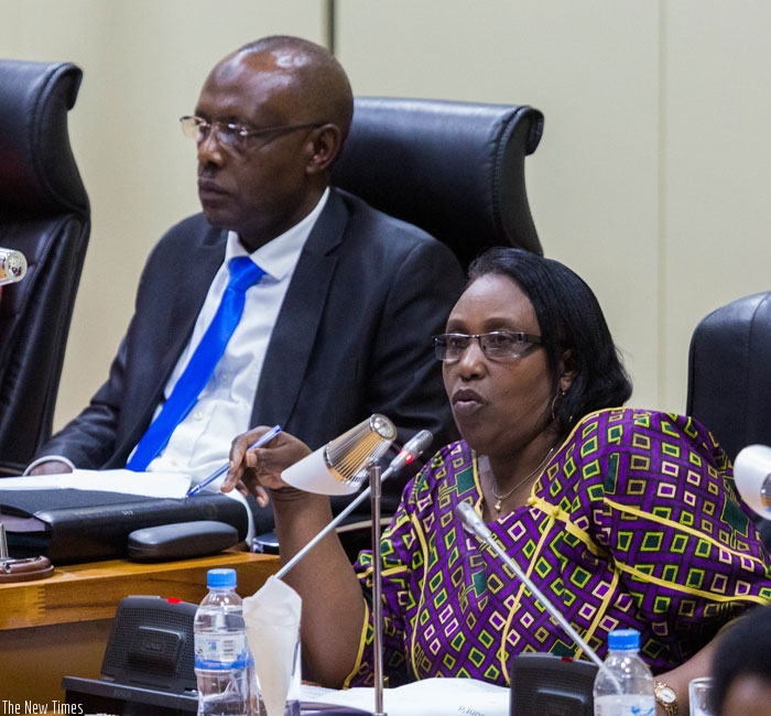 MP Alphonsine Mukarugema, deputy chairperson of the Standing Committee on Social Affairs speaks in parliament, as Deputy Speaker Abbas Mukama (L) looks on. (Timothy Kisambira)