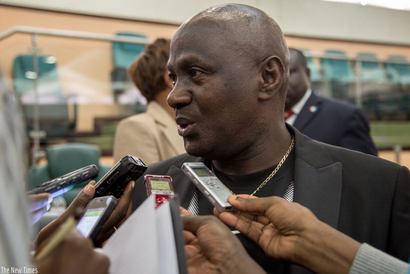 EALA member Amb. Ngendakumana speaks to journalists yesterday at the Senate. (Doreen Umutesi)