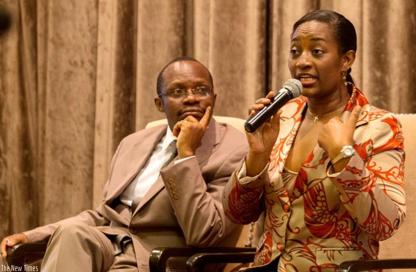 Virginia Nkwanzi Isingoma, managing director of global marketing firm Ipsos (R), during a panel discussion at the release of a report of a survey about citizens' perceptions in Kigali yesterday. (Timothy Kisambira)