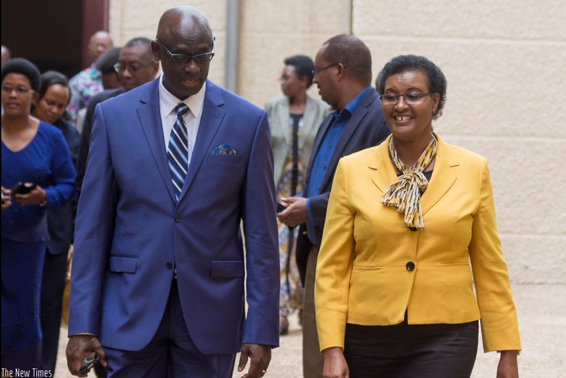 Busingye (L)chats withSpeaker Donatille Mukabalisa at Parliament yesterday. (Timothy Kisambira)