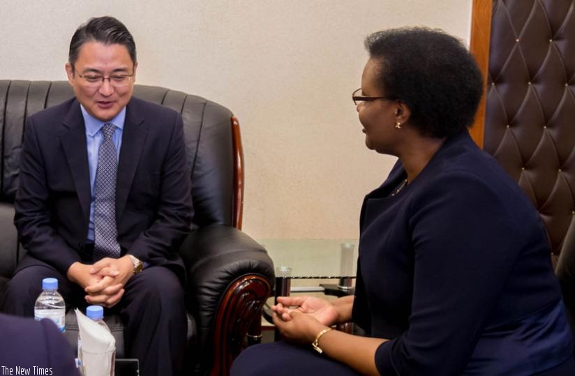 South Korean Ambassodor to Rwanda Park Yong-min (L) in discussion with Speaker Donatille Mukabalisa during his courtesy call on Parliament yesterday. (Timothy Kisambira)