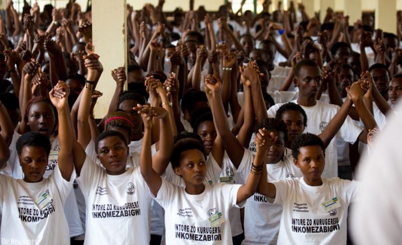 Students join hands as a sign of unity during the closing ceremony of the civic education training last year. (Timothy Kisambira)