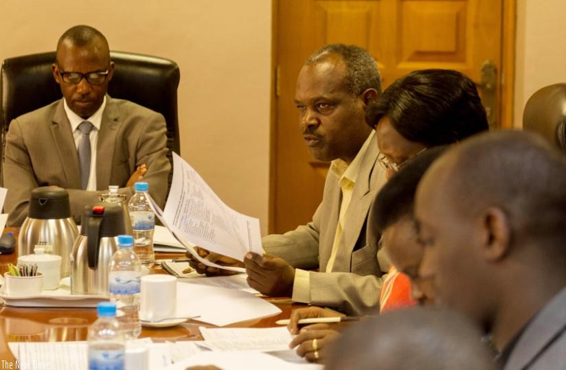 Habiyakare (2nd L) explains the commission's activities to senators yesterday. (Timothy Kisambira)