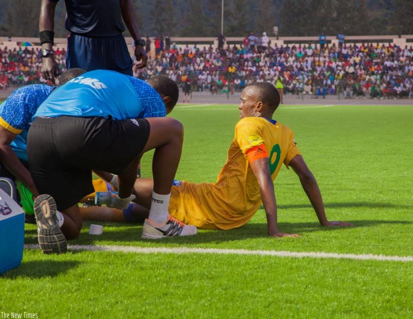 Amavubi captain Tuyisenge receives treatment during the friendly against DR Congo on Sunday. (F. Niyigena)