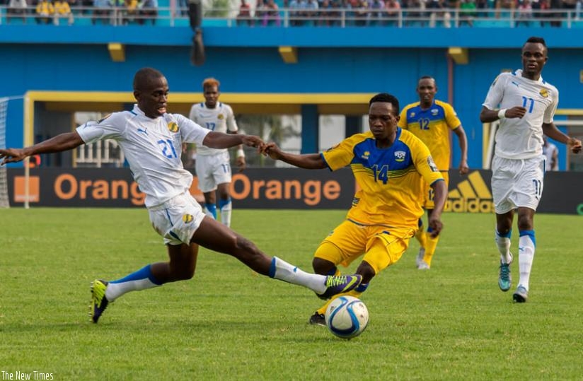 Gabon's Rodrique Moundougua (L) vies for the ball with Amavubiu2019s left back Celestin Ndayishimiye during Wednesday's clash at Amahoro stadium. (T. Kisambira)