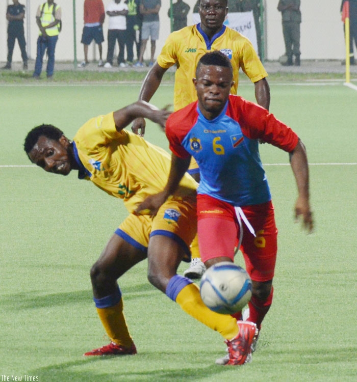 Amavubi forward Dominique-Savio Nshuti battles with DR Congo midfielder during the friendly match three weeks ago. (S. Ngendahimana)