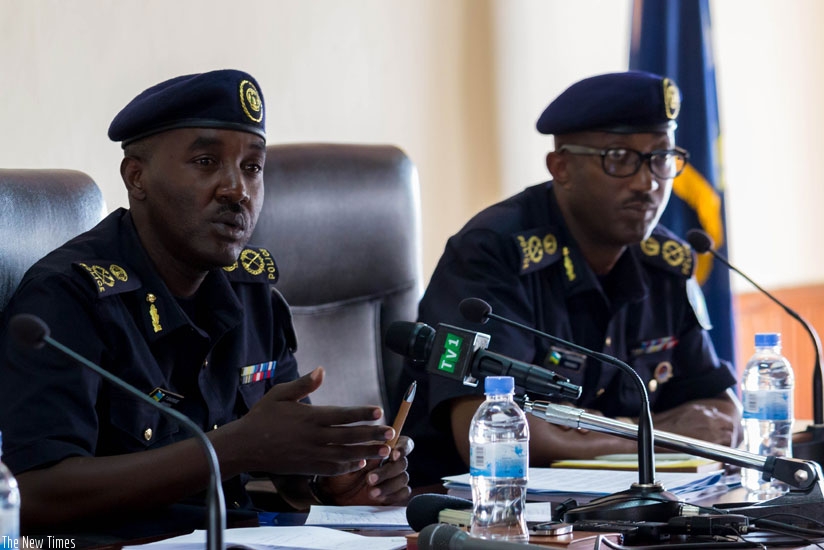 Theos Badege, the commissioner for CID (L), speaks to media as Police spokesperson Celestin Twahirwa, looks on. Badege said a number suspects linked to Munyengango are currently in police custody, while others are still at large. (Timothy Kisambira)