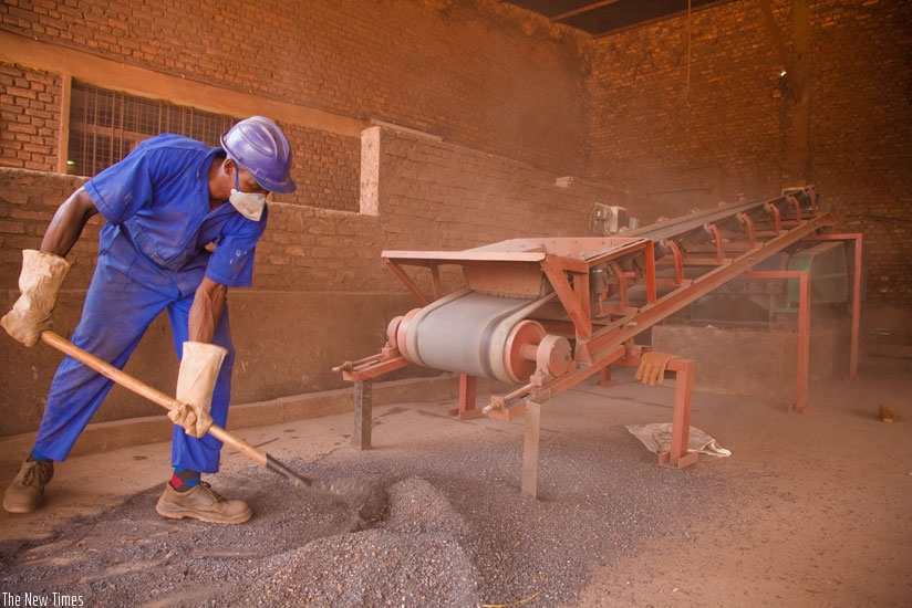 A worker at Minerals Supply Africa company in Gikondo purifies minerals. International prices for minerals declined slowing down the economic growth rate. (Timothy Kisambira)