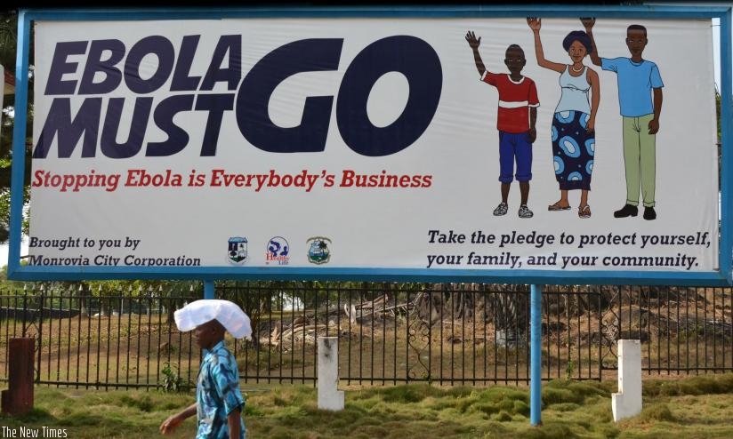 Ebola awareness billboard in Monrovia, Guinea. (Photograph: Zoom Dosso/AFP/Getty Images)