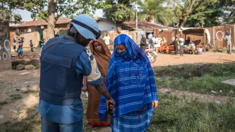 A Burundian soldier of the U.N. peacekeeping force MINUSCA contingent uses a metal detector at the entrance of a polling station in Bangui, Central African Republic on Dec. 14, 2015. EU plans to cut back its funding for Burundi's lucrative peacekeeping contingent in Somalia to try to force President Pierre Nkurunziza into talks with opponents. (Internet photo)