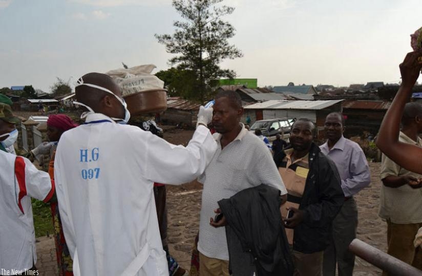 A medical practitioner screens people for Ebola. (File)