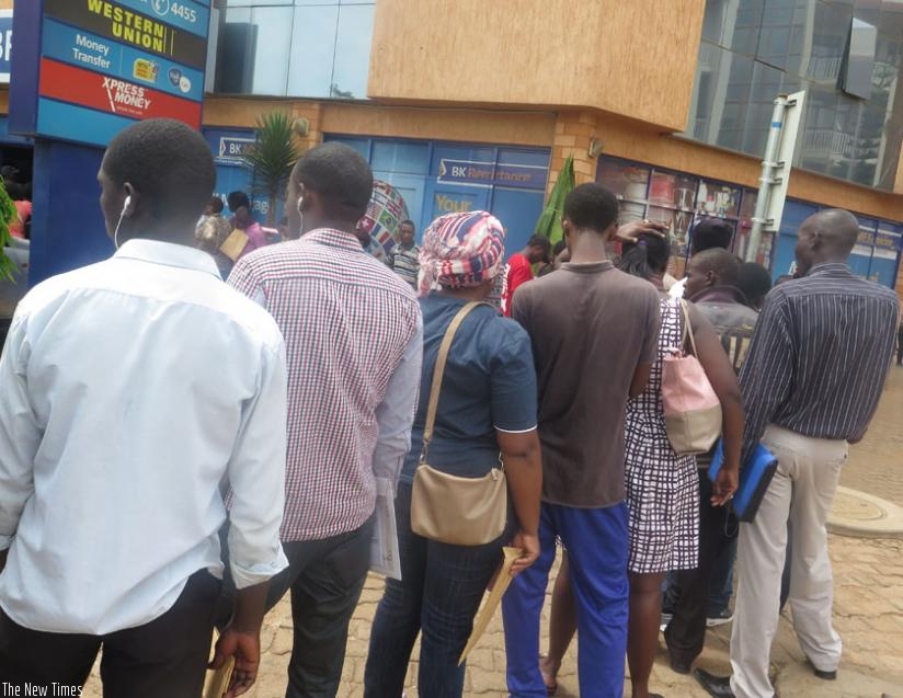 People queue at Bank of Kigali Remera branch to pay taxes yesterday. (Lydia Atieno)