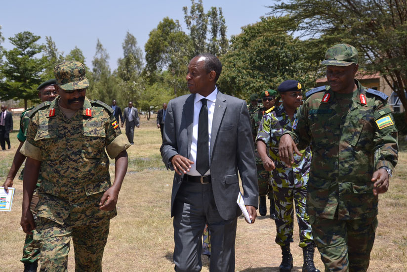 (L-R) Lt Gen Ivan Koreta from UPDF chatting with Amb Kimonyo and Brig Gen C Karamba at the conclusion of the exercise in Nairobi (Courtesy)