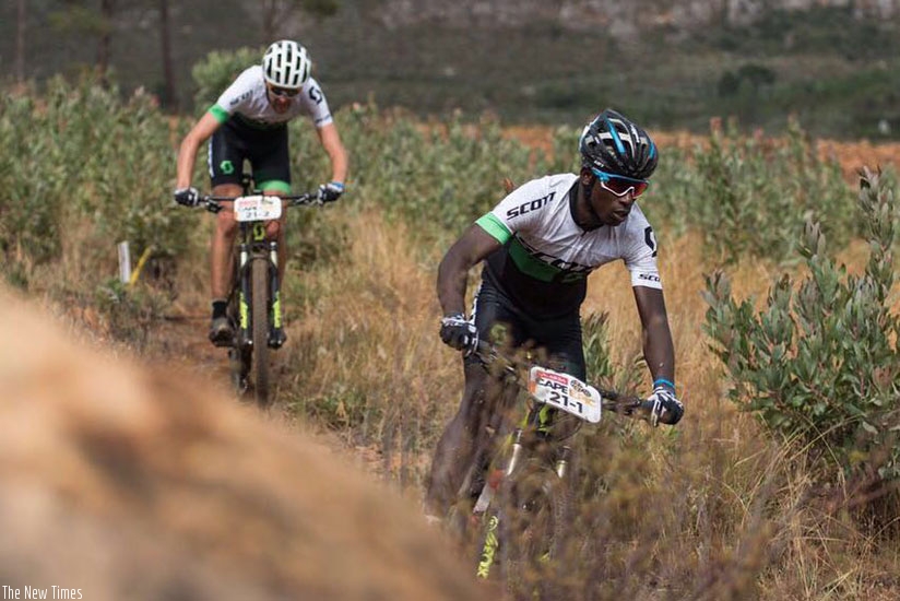 Nathan Byukusenge (front) in action during this year's Absa Cape Epic in South Africa. The Rwandan cyclists has qualified for the Rio Olympics Mt. Bike. (Courtsey)