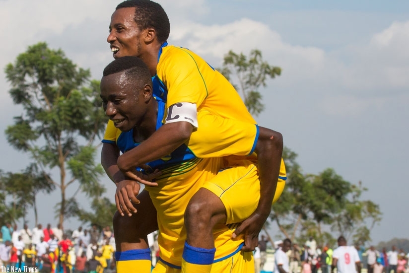 Blaise Itangishaka carries Dominique-Savio Nshuti, who set him up for Rwanda U-20 team's goal against Uganda Hippos in the first leg. 