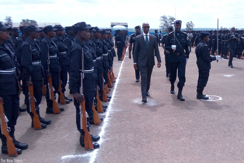 The Minister for Internal Security, Sheikh Musa Fazil Harerimana, inspects a guard of honour during the graduation of officers at Police Training School Gishari in Rwamagana District yesterday. (Courtesy)