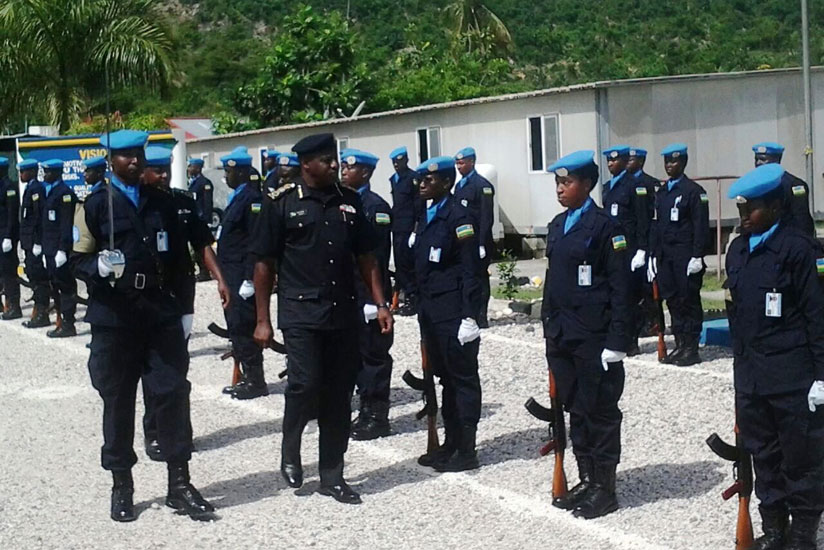 IGP Emmanuel K. Gasana inspects a guard of honour at Rwanda Formed Police Unit (FPU) in Jeremie, Haiti. (Courtesy)