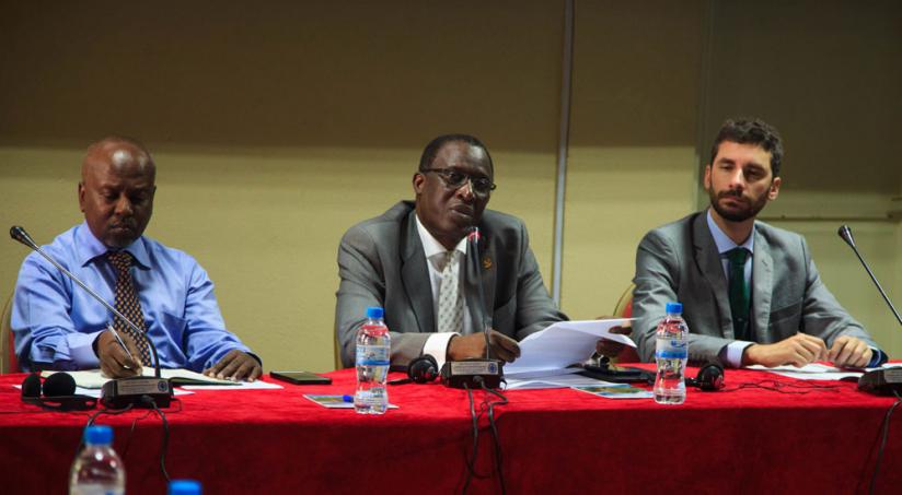 Attaher Maiga (C) opens the workshop as Charles Murekezi, Agri_business DG in MINAGRI (L) and Fillipo Brasesco from FAOSFE look on. (Teddy Kamanzi)