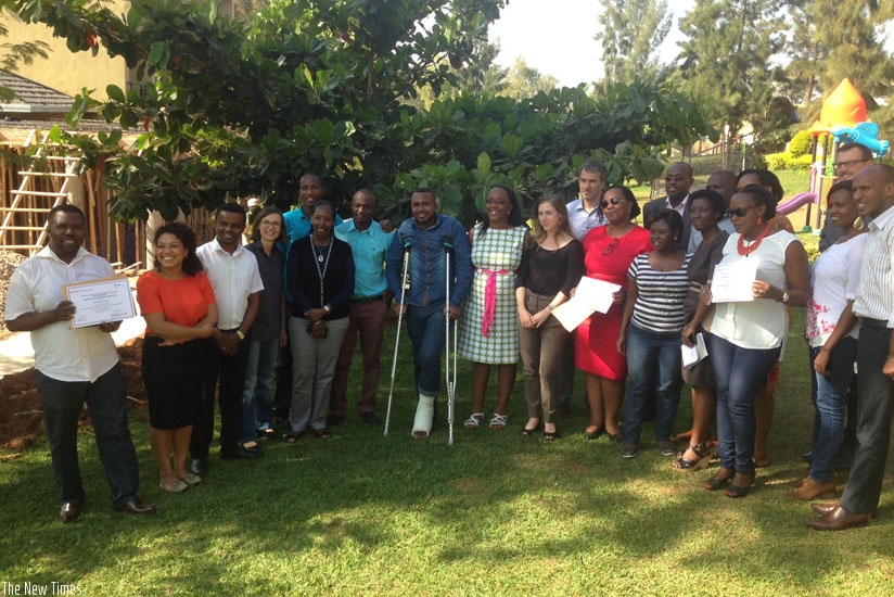 Participants pose for a group photo after the training. (Moses Opobo)