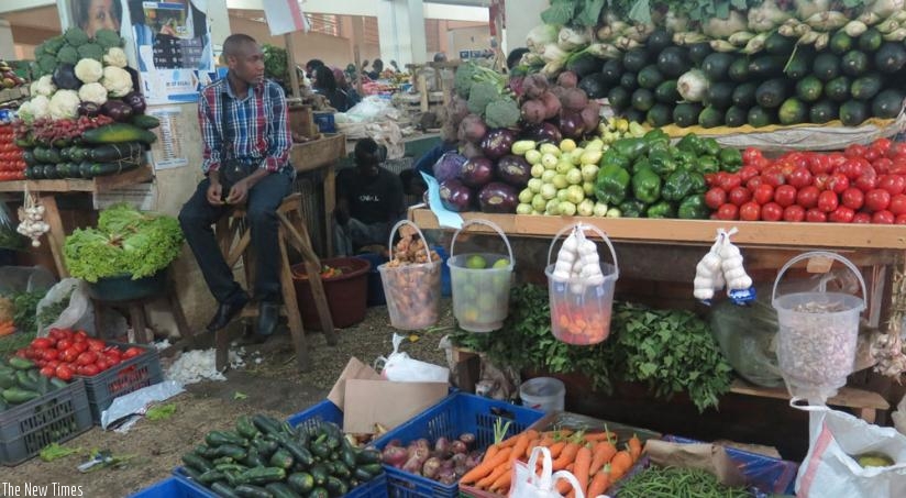 Vegetable vendors await customers at City Market in Nyarugenge District. (File)