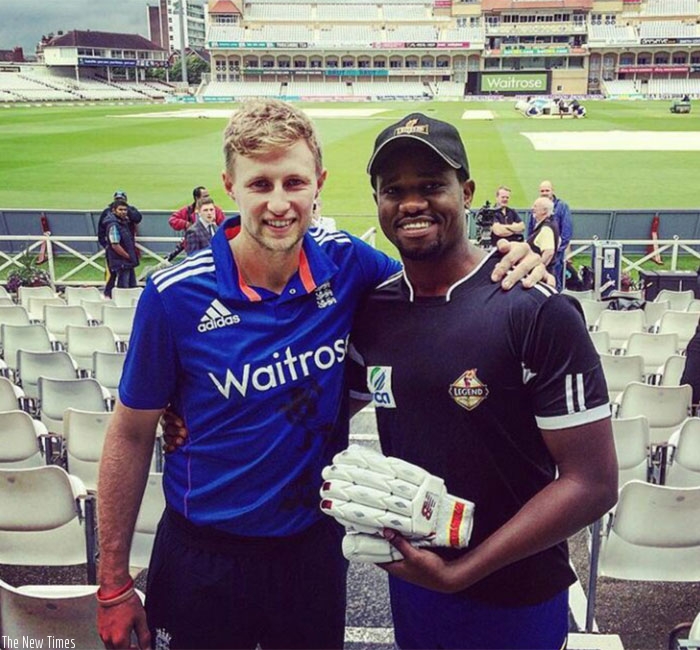 Eric Dusingizimana (R) with Joe Root.