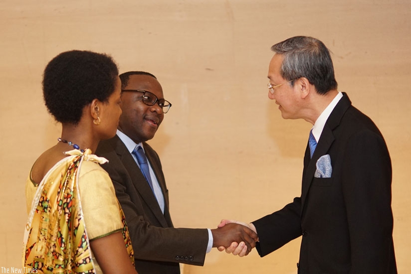 Amb Guillaume Kavaruganda with Chin Siong, Singapore's Minister of State in the Office of the Prime Minister. (Courtesy)