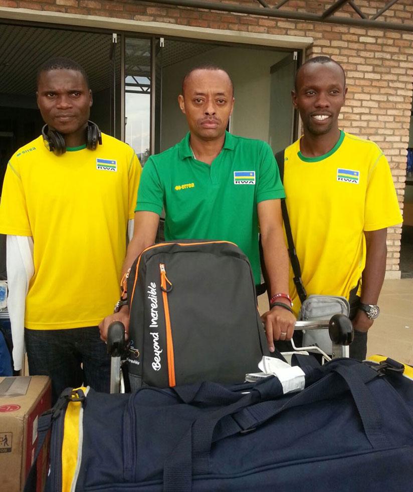 Ndayisenga (left) and Muvunyi (right) together with their trainer Eric Karasira at Kigali International Airport upon return from Tunis in March. (Courtesy)