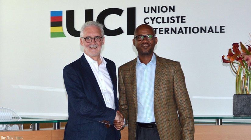 UCI president Brian Cookson OBE with Bayingana at the UCI headquarters yesterday.