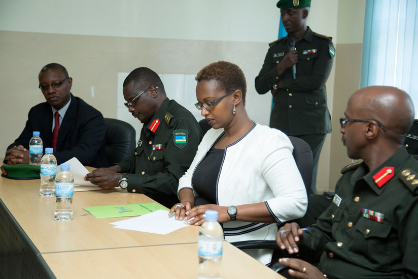 Dr Alexis Butera, Clinical Service Division Manager, Rwanda Military Hospital, Kanombe (2nd left), and Urujeni Bakuramutsa, Director General, Imbuto Foundation, sign a Memorandum of Understanding at the hospital in Kigali, yesterday. (Courtesy photos)