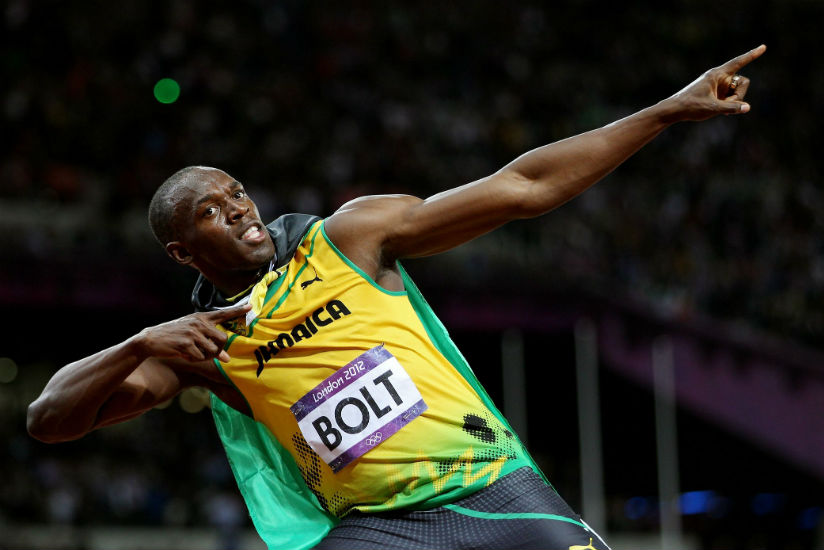 Bolt creates his trademark 'lightning bolt' pose for the cameras as he celebrates yet another Olympic success. / Internet photo.