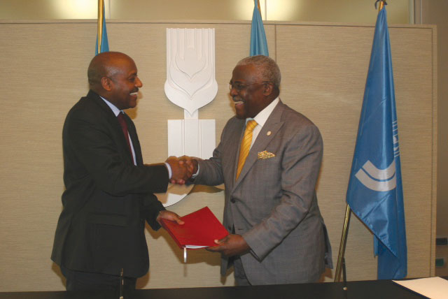 Amb. Nyangezi (L) and IFAD's Nwanze after signing the deal in Rome yesterday. / Courtesy