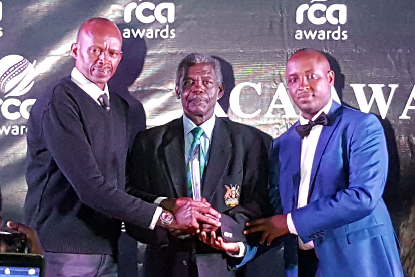 Ugandan coach William Kamanyi (C) receiving his Lifetime Achievement Award from Lt. Col. Rugambwa (L) and Haba (R). / Courtesy