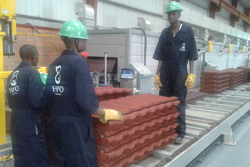 Workers of Hippo, a local firm that makes roofing materials. There is need for a more supportive policy to spur industrial growth. (File photo)