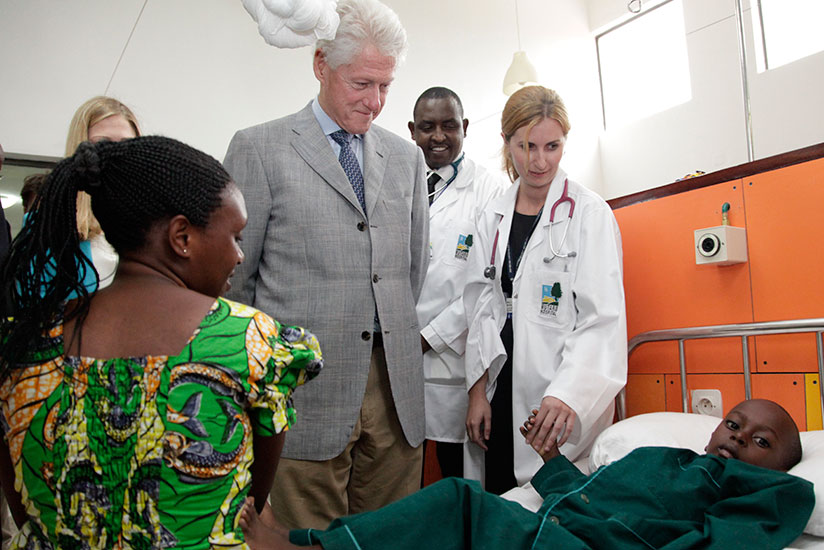 Former US President Bill Clinton tours Butaro Cancer Hospital in 2012. / File