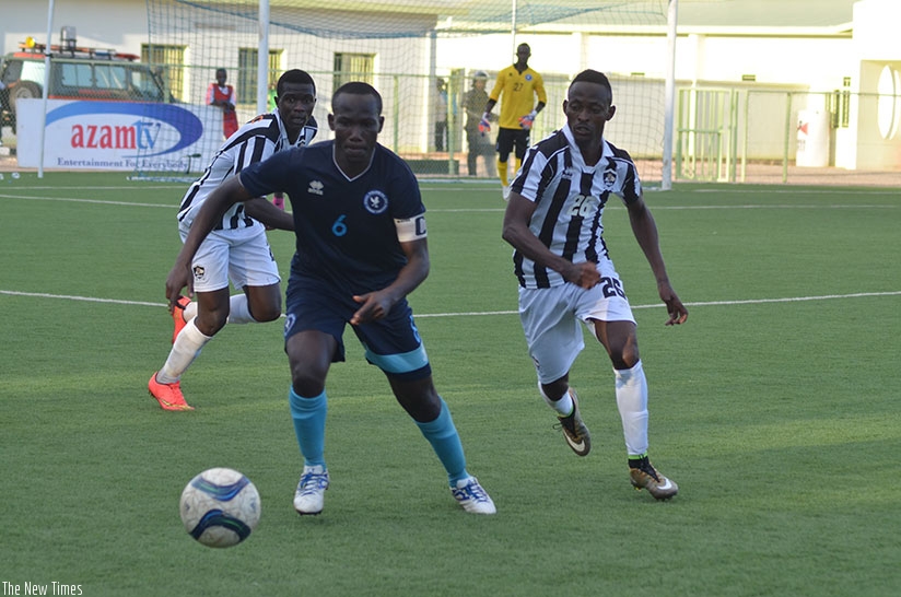 Police FC captain Fabrice Twagizimana goes for the ball against APR's Issa Bigirimana during a recent league match.