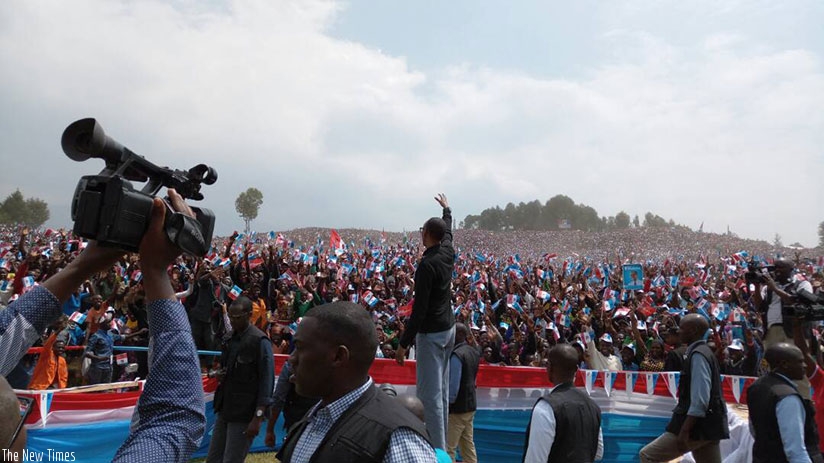 Kagame greets the over 200,000 RPF supporters that turned up for his rally at Busogo Grounds in Musanze District. (Photos by Athan Tashobya)