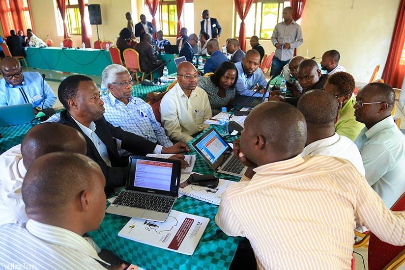 Some of the educationists during a group discussion at the workshop in Kigali yesterday. The experts said competency-based curricula needs regular assessment. (Faustin Niyigena)