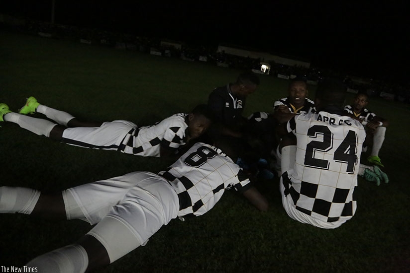 APR FC players wait for power following blackout interruption. During the game, power went off twice in first half before one last straw in the second half that stretched to more t....