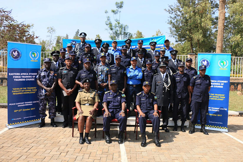 The commandant of PTS, CP Vianney Nshimiyimana, head of EASF Police component ACP Dinah Kyasimire, Chief Supt. Claude Tembo and course participants in a group photo. / Courtesy