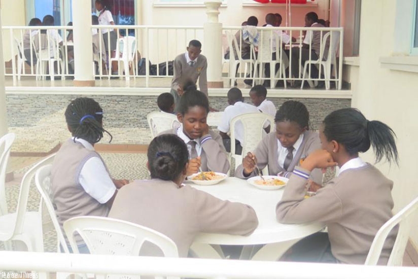 Students share a meal. The boarding school environment  helps students to learn to be independent. (Lydia Atieno)