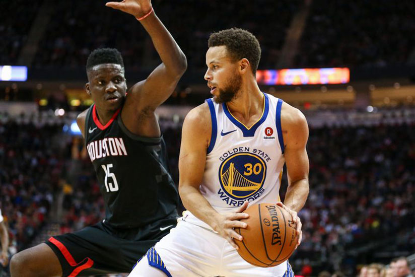 Golden State Warriors guard Stephen Curry (right) dribbles against Houston Rockets centre Clint Capela. Net photo