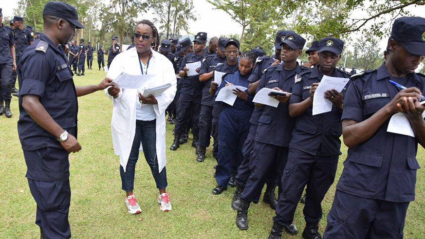 Police officers lining up and filling forms to donate blood