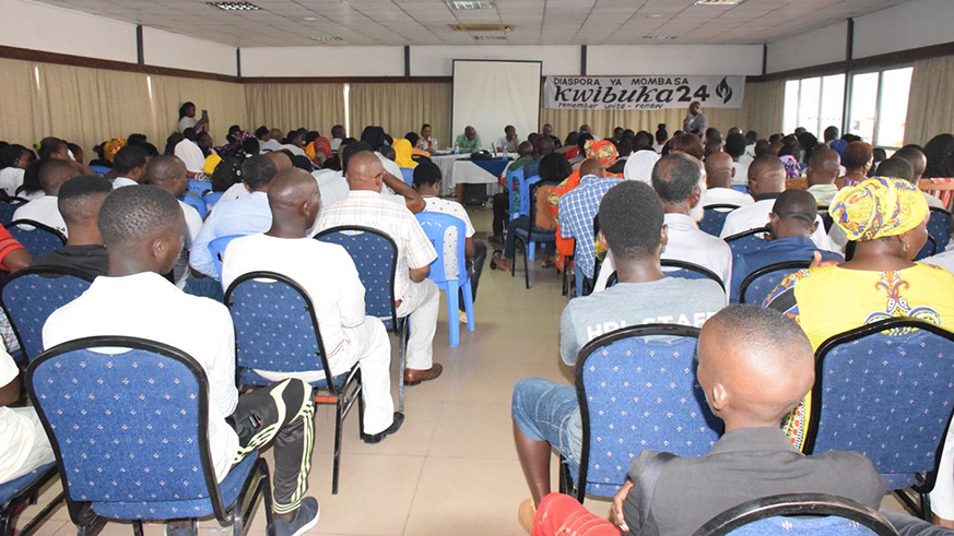 Mourners listen to the testimony of Jean Ndayisaba,  a Genocide survivor.