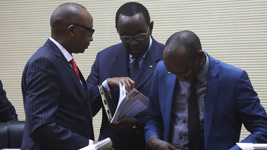 Auditor General Obadia Biraro chats with President of the Senate Bernard Makuza after addressing Members of Parliament in Kigali yesterday (Sam Ngendahimana)